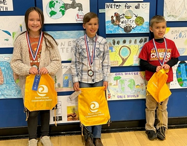 SECOND-GRADE POSTER WINNERS from Rooks County for 2023 include, from left: 1st Place, Kendall Hrabe, Plainville Elementary; 2nd Place, Weston Berland, Damar Elementary (not pictured); 3rd Place, Derrick Rudman, Sacred Heart; and 4th Place, Wyatt Belzer, Sacred Heart.