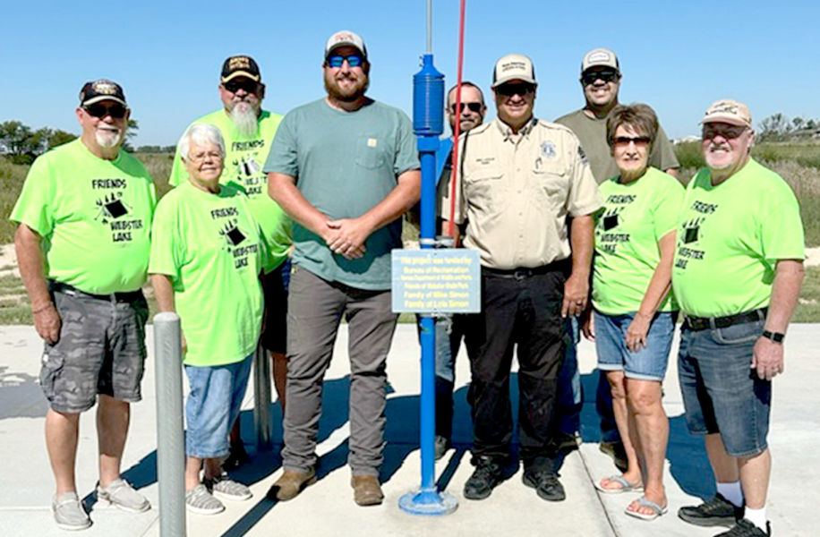ATTHE DEDICATION of the new dump station at Webster State Park were (from left) Chuck and Mary Timmons, Ray Palmer, Chad Simon, Adam Bryant, Zach Kesler, Ethan Kriley, and Connie and Don Jenkins. (Picture courtesy of Chris Palmer.)