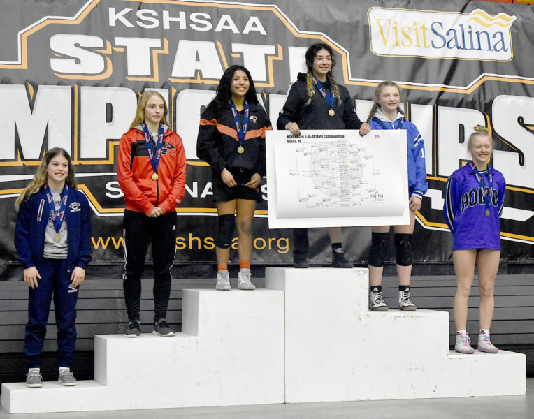 ASHLYN HAHN, second from right, is the first female wrestler from Stockton to win a State medal, placing third in the 115-lb. weight class. (Photo courtesy of Bobbi Basart)
