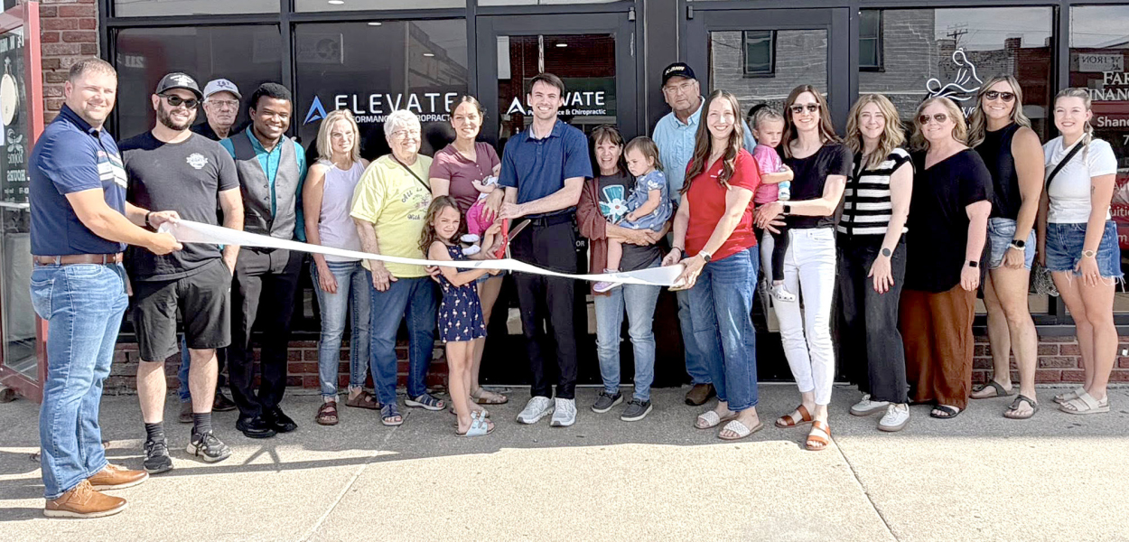 A RIBBON CUTTING was held for new business Elevate Performance and Chiropractic, located at 213 West Mill Street in Plainville on Friday, May 29th with the following present for the event (from left): Justin Casey, Adam Comeau, Brad Yowell, Friday Otuya, Krisson Timken, Leona Newell, Stella Newell, Kate Newell, Kolt Newell, Rhonda Newell, Sutton Newell, Brian Newell, Jaci Wise, Hollis Comeau, Ashley Comeau, Samantha Pfannenstiel, Kelli Hansen, Nichole Ganoung, and Mayce Deuel. (Photo Courtesy of Peggi Axels