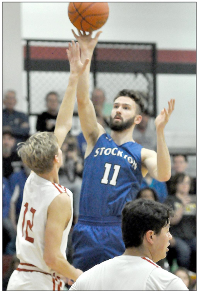 KAMERAN HAMEL shoots for two of his 10 points in the Tigers’ 74-32 win over Logan in the Regional finals at Mankato last Saturday.