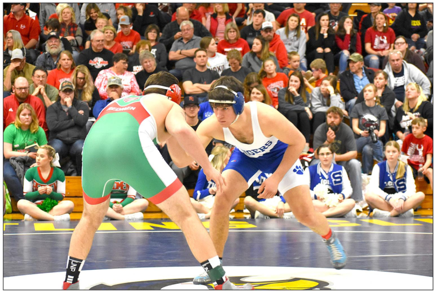 TIGER WRESTLER Rylan Basart, right, wrestling at 182 lbs., is shown here looking to shoot for a take down against Brell Spiess of Smith Center. Basart finished the Regional Tournament in Norton placing 4th and earning his first trip to the State Wrestling Tournament. (Photo Courtesy of Bobbi Basart)