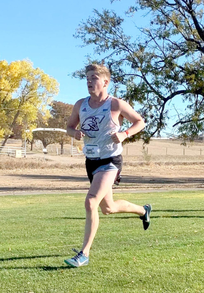 CHAYSE MCCULLOUGH runs at the Regional Championships in Colby on October 30th. The team of seven runners won the meet, becoming the first men’s team from Colby to win Region VI since 2014.