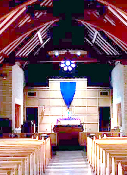 THE DIMLY-LIT SANCTUARY of St. Thomas Catholic Church was the setting chosen by Isaac Reed when he and his mother, Karen, provided worship music on Facebook Live, April 2nd.