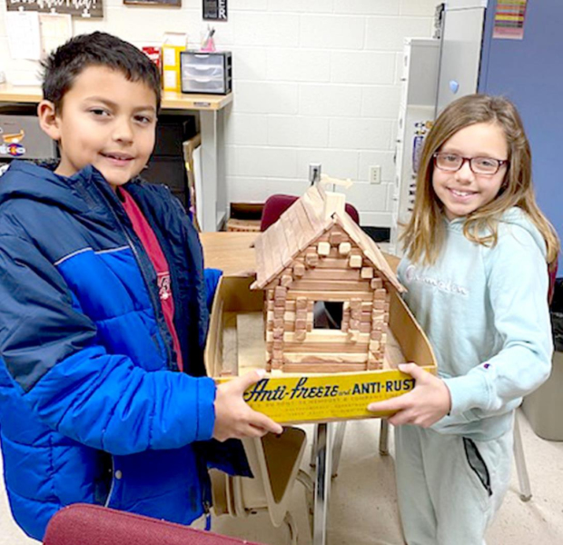 STOCKTON GRADE SCHOOL students are excited to have received an unexpected gift of fraction blocks and Lincoln Logs, shown here by third-graders Cody Troester and Maleigha Horn, crafted by John Will from Halstead. This story is a "must read!"
