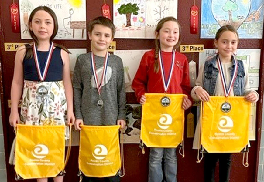 THIRD-GRADE POSTER WINNERS from Rooks County for 2021 include, from left: 1st Place, Brooke Benoit, Damar Elementary; 2nd Place, Brogan Pfaff, Plainville Grade School; 3rd Place, Leilah Slaubaugh, Sacred Heart; and 4th Place, Kaylyn Becker, Sacred Heart.