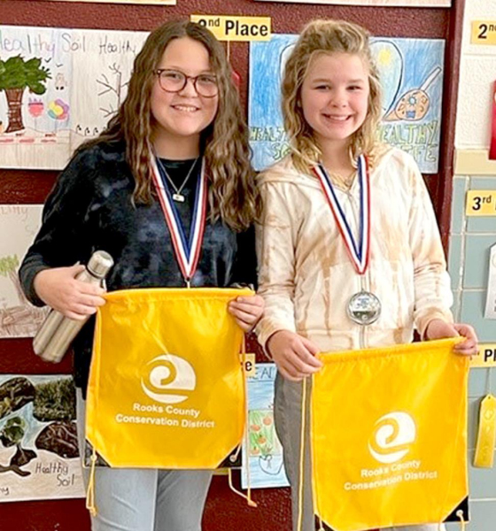 FIFTH-GRADE POSTER WINNERS from Rooks County for 2021 include, from left: 1st Place, Natalie Garcia, Plainville Grade School; and 4th Place, Kinely Atchison, Plainville Grade School. Not pictured are: 2nd Place, McKenna Horn, Stockton Grade School, and 3rd Place, Macie Stahl, Sacred Heart .