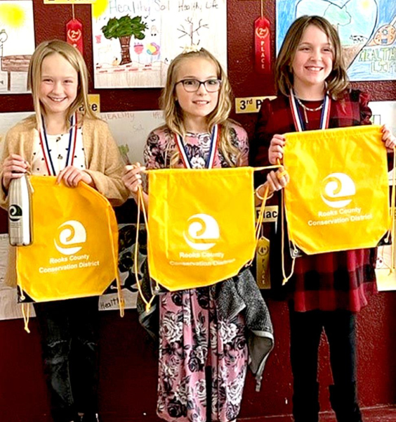 FOURTH-GRADE POSTER WINNERS from Rooks County for 2021 include, from left: 1st Place, London Waggoner, Plainville Grade School; 2nd Place, Hayden Hilgers, Plainville Grade School; Navaeh Garrett, Plainville Grade School. Third place winner, Caden Keas, Plainville Grade School, is not pictured.