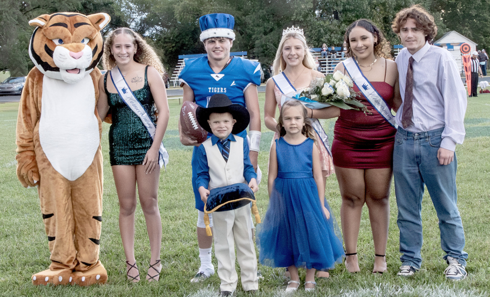 STOCKTON’S 2025 HOMECOMING King and Queen were crowned last Friday night. Standing from left, are: Tiger Mascot, Temprance Northup, King Cameron Balthazor, Queen Saj Snyder, Caleigha Fast and Josiah Hutton. Crown bearers were Weston Biggs and Margaret Berkley.