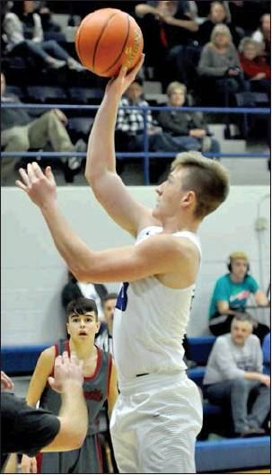 QUINN COFFEY SHOOTS FOR TWO late in the game between the Stockton Tigers and Plainville Cardinals last Friday night.
