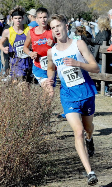 JONNY HAMEL leads two of his competitors around the curve at Sand Plum Nature Trail, the site of the Class 1A State Cross Country Championships.