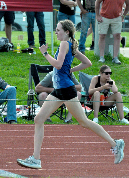 CHEYENNE HOETING eyes the finish line of the 1600M Run at Regionals held last Thursday in Washington. Hoeting not only qualified for State in the event, but she also set a new school record.