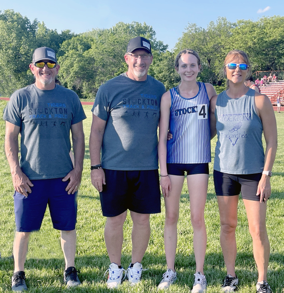STOCKTON HIGH SCHOOLTRACK COACHES Justin Basart, Clint Bedore and Janet Kuhlmann (far right) are all smiles following’s Cheyenne Hoeting’s qualifying for State in the 1600 Meter Run.