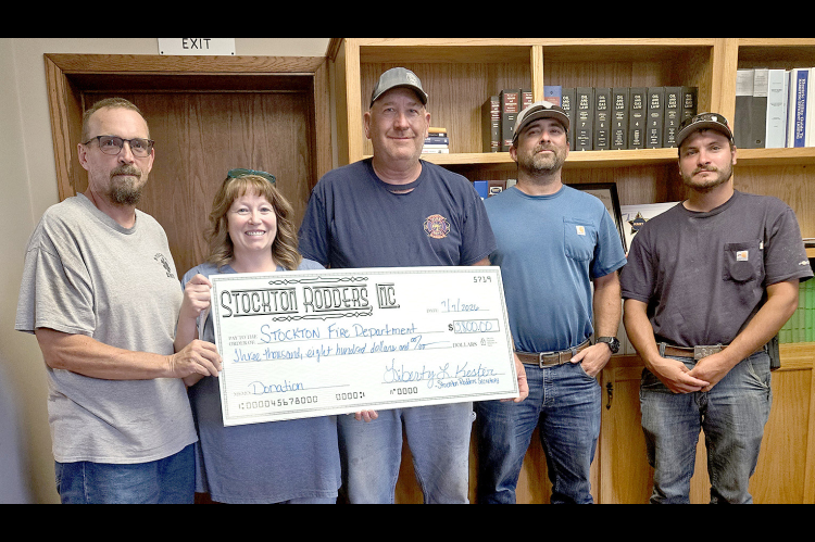DURING THE STOCKTON CITY COMMISSION MEETING on Tuesday, July 7th, the Stockton Fire Department was presented with a $3,800.00 donation check from the Stockton Rodders, Inc. from the proceeds of their annual Cruise Night and Car Show. The funds will go to purchase much-needed equipment for the department. Pictured are (from left) Adam Bryant and Libby Kester representing the Stockton Rodders, fire chief Ray Niblock and firemen Mitch Gibbs and Riley Wise.
