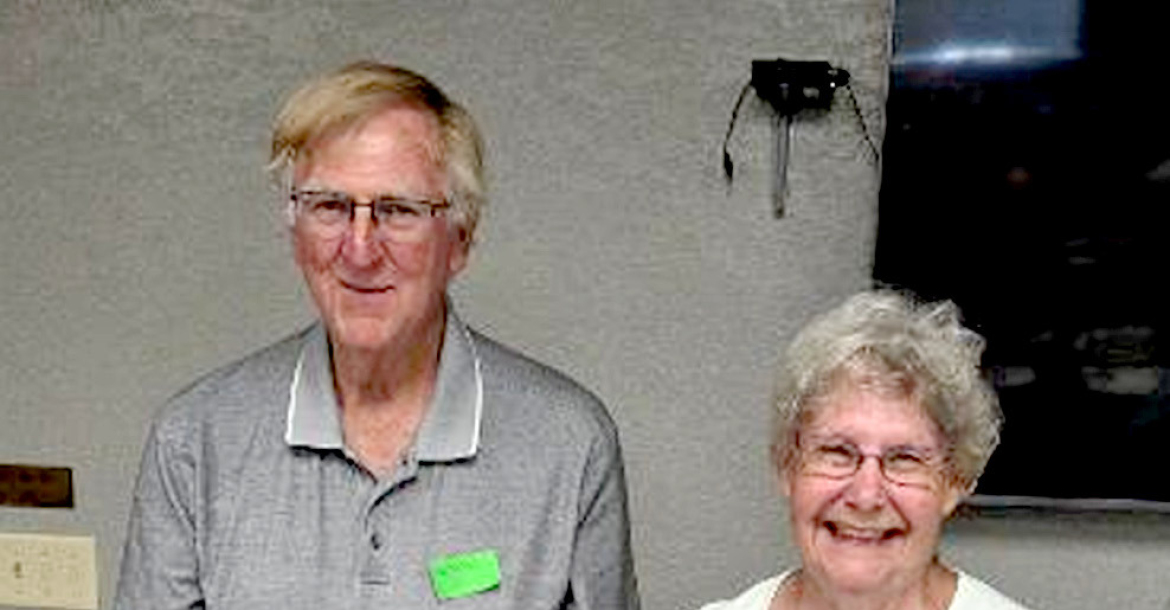 MAX LINN DIBBLE and Muriel Melton Morgenthaler stand proudly in front of the 60-year Woodston Class reunion cake, celebrating six decades since their graduation. (Courtesy Photo)