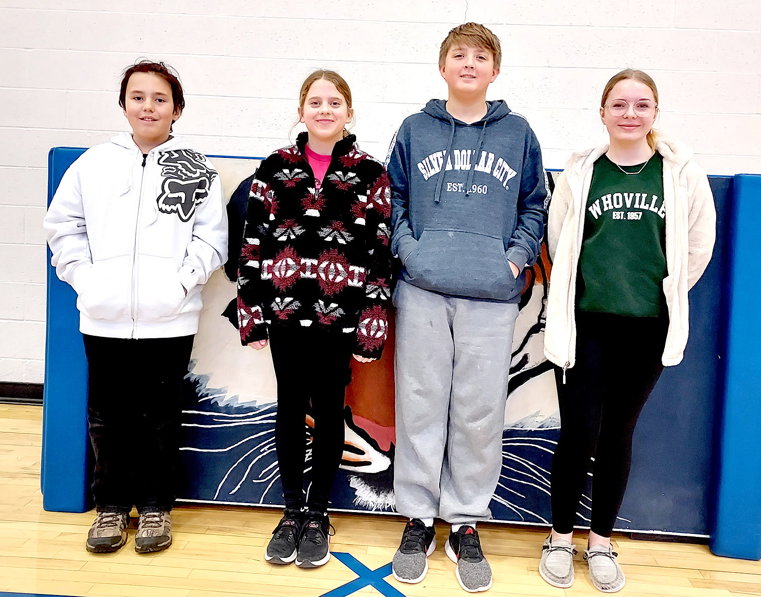 REPRESENTING STOCKTON GRADE SCHOOL at the Rooks County Spelling Bee on Wednesday, February 8th, at the Nova Theatre are (from left): champion Golden Potter, Mia Odle, Damon Muir, and Lyric Snyder.