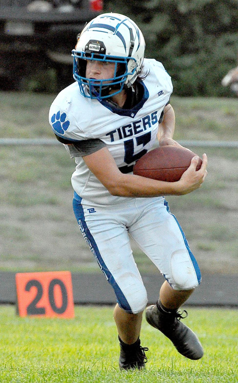 EMERSON LOWRY looks upfield after catching a kickoff from the Trojans during the game against Logan/Palco last Friday.