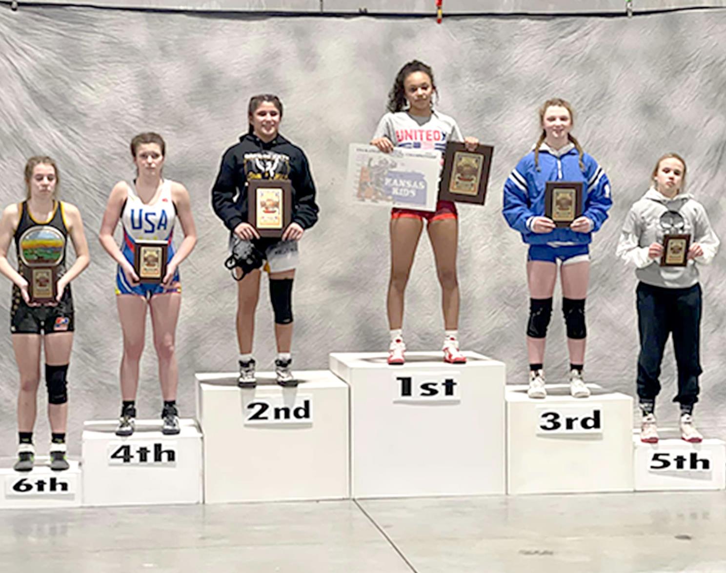 ASHLYN HAHN (second from right) placed third at the USAWKS 2022 State Folstyle Wrestling Championships in Topeka in the Girls’ 14 &amp; Under 119-lb. division.
