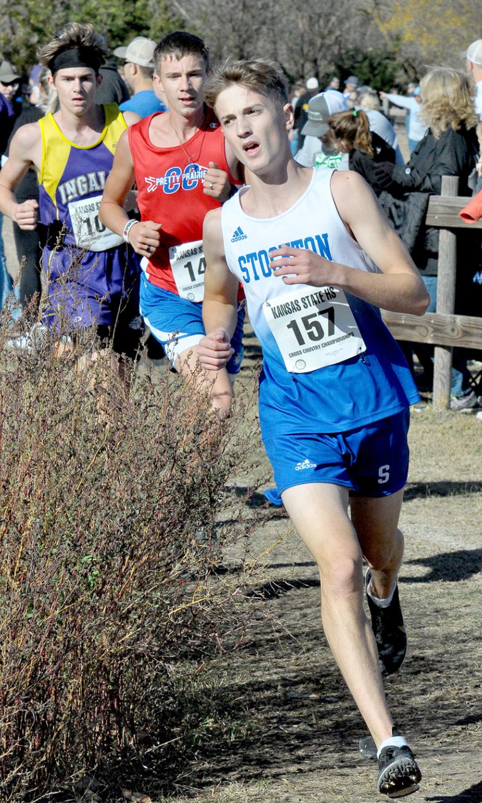 JONNY HAMEL leads two of his competitors around the curve at Sand Plum Nature Trail, the site of the Class 1A State Cross Country Championships.