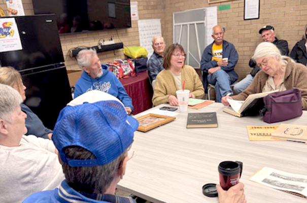 SUSAN STAHL (center) shares information at Local History Day.