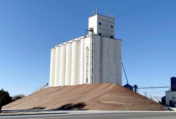 THE COLORFUL PILE OF MILO AT FARMERS UNION ELEVATOR
