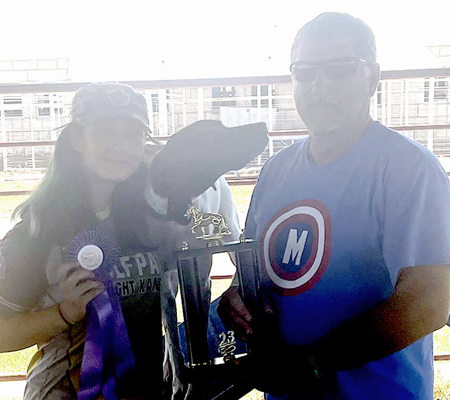 KEVIN EICKHOFF (right) presented the High Scoring Off Lead Trophy to Jayana Creighton and Rocky during the 2023 Rooks County Free Fair. The trophy was in memory of Malachi Miller. (Courtesy Photo)