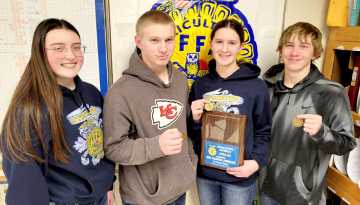 THE STOCKTON FFA GREENHAND MEMBERS showing off their medals and first place plaque from the Northwest District Meats Judging Contest held in Grinnell on Saturday, February 1st, are (from left) Kourtnie Bird, twelfth place; Isaac Thayer, fifth place; Meredith Gasper, first place; and Vincent Thayer, fourth place.