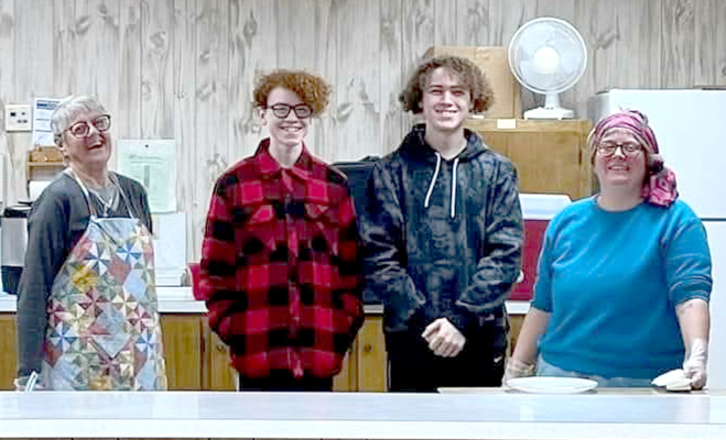 Pictured (from left) are Bert Niblock, Ronan, Adam, and Clare Ballard (Walker Senior Center Site Manager). Courtesy Photo