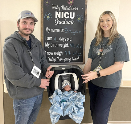 NEW YEAR’S BABY, BRAYDEN RAY, is pictured with his daddy and mommy, Riley and Megan Wise, on the day they were headed home after his two-week stay in the NICU.