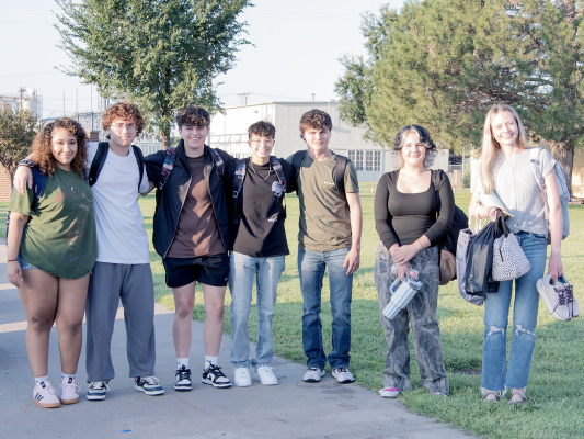 SEVERAL MEMBERS OF THE SENIOR CLASS gather on the morning of August 18 prior to entering the school for their last first day at SHS. From left, are: Caleigha Fast, Josiah Hutton, Kelsie St. Clair, Carolina Northup, Cameron Balthazor, Piper Creighton, and Cheyenne Hoeting.