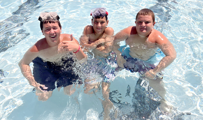 ON ONE OF THOSE TRIPLE-DIGIT, summer days this Monday afternoon, July 29, Tristynn St.Clair, Vincent Antonini, and Parker Pasilias were cooling off at the Stockton Swimming Pool.