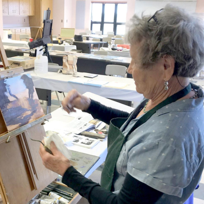 BONITA OLIVA of Stockton paints a landscape scene.