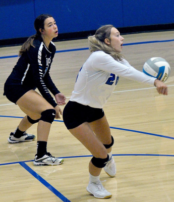 LADY TIGER CLAIRE PLUMER receives a serve during the match against Hoxie, while teammate Bodye Stithem looks on. The action took place on September 14 in Stockton.