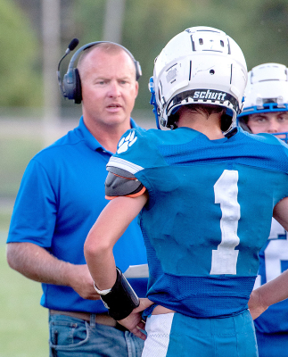 Head Coach Don Moffet with Jace Kesler (#1) and Cameron Balthazor (background) vs. Lakeside