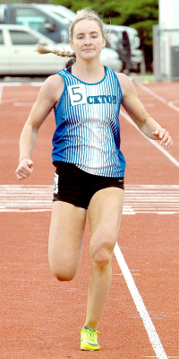 Ava Dix nears the finish line of the 200 M Dash at Plainville Invitational track meet