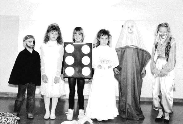 THE SECOND PLACE WINNERS of the 1989 VFW Auxiliary Halloween Costume Contest were (from left): Tyler Smith (Kindergarten) as a pirate; Cassie Waddell (First Grade) as a princess; Betsy Lewis (Second Grade) as a dice, Shannon Lowry (Third Grade) as a bride, Mindy Hollern (Fourth Grade) as an ice cream cone, and Rebecca Denton (Fifth Grade) as a harem lady.