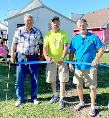 A RIBBON CUTTING CEREMONY was recently held for the expanded park project in Damar. Pictured are Commissioner Kenny Newell (center), along with Dennis Balthazor (left) and Jim Desbien (right). (Courtesy Photo)