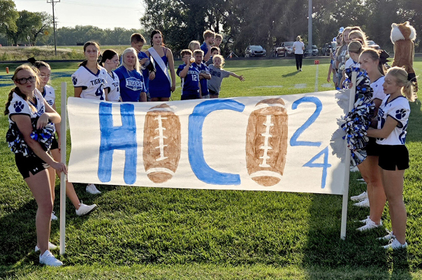 THE CHEERLEADERS, students, and community members formed a tunnel before the SHS Homecoming game on Friday evening, September 13th, to cheer on their Stockton Tigers!