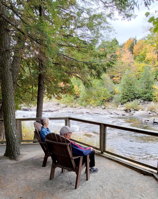 BOB AND NANCY BECKER enjoyed sitting in Adirondack chairs in the Adirondack Mountains.