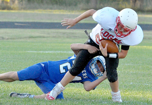LINCOLN KELLER makes a good defensive play during the Stockton vs. Logan/Palco football game held at Tiger Stadium last Thursday evening.