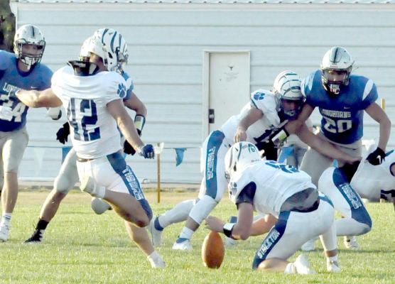 TIGER JUNIOR RYLAN BASART scored the first points of the game when he kicked the ball through the uprights from 32 yards out to give Stockton a 3-0 lead over the Longhorns. Holding the ball for Basart was senior teammate Troy Rogers. The Tigers went on to fall in double overtime to Thunder Ridge by the score of 20-14.