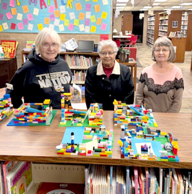 TONI ANDERSON, Bertha McGann, and Linda Gardner from the VFW Auxiliary in Plainville. They judged the LEGO build contest on January 12. (Courtesy Photo)