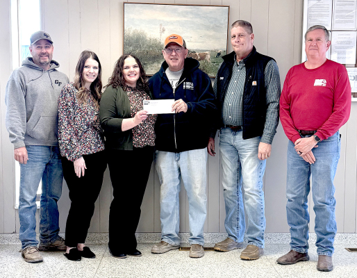 ON HAND FOR THE CHECK PRESENTATION to Heartland Community Foundation by Midland Marketing included, from left, Midland Marketing Board Member Ryan Griffin, Heartland Board Member Justine Benoit, Rooks County Development Director for Heartland Community Foundation Deanna Hammerschmidt, Midland Marketing Board Member Tom Benoit, Midland Marketing CEO Kevin Royer, and North Area Manager for Midland Marketing Todd Churchill.