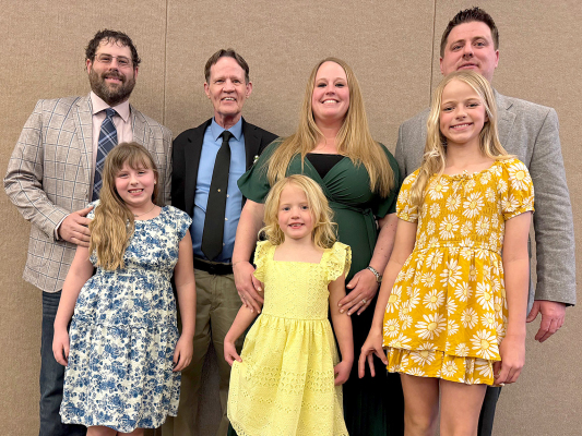 PICTURED with Vance Westhusin at his Kansas Coop Council’s Hall of Fame Induction Ceremony are from left to right: son Jonathan Westhusin and daughter Shay, Vance Westhusin, daughter Anna Schonthaler and husband Blake, and daughters Emily and Samantha.
