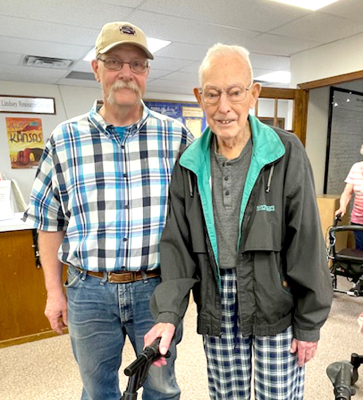 FRANCIS MAHONEY, who is one of the long time members of the Rooks County Historical Society, visited at the Rooks County Museum a few days before the annual meeting. Here he is pictured with Museum Coordinator Rick Gianni (left).