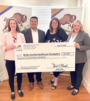 THE ROOKS COUNTY HEALTHCARE FOUNDATION was awarded $25,000 implementation grant as part of the Office of Rural Prosperity's Rural Champions grant program. Receiving the check is Kandie Morain (second from right), a Rooks County Rural Champion. Presenting the check include, left to right: Kerri Falletti, Office of Rural Prosperity; Matthew Godinez, Asst. Secretary of Quality Places; Morain; and Trisha Purdon, Director of Office of Rural Prosperity