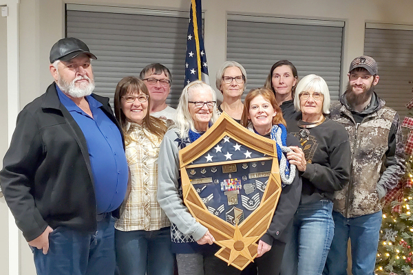 GATHERING AT THE CELEBRATION for Master Sergeant Jenny D. Dix for her 20 years of service in the United States Air Force include, from left, Dean Thomas, Emily Farrington, Michael Patterson, Nancy Dix, Sally Thomas, Jenny Dix, Sarah Beckman, Janice Patterson, and Nicholas Beckman.