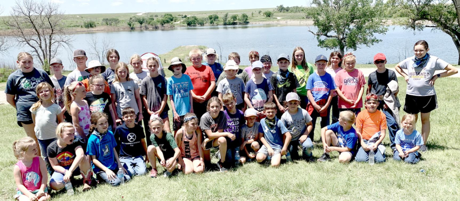 LOTS OF FISH were caught by this group at the Outdoor Adventure Day Camp held on Monday, June 6, at the Rooks State Fishing Lake, with Jake Brooke, Graham and Rooks County Game Warden, and Chris Hanson, Kansas Forest Service, sharing their expertise with the youth. The youth enjoyed playing games, such as cornhole, washers, horseshoes, and parachute.