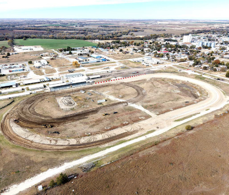 A DRONE-CAPTURED AERIAL PHOTO from Rooks County Emergency Management reveals the impressive transformation at the Rooks County Fairgrounds, showcasing the newly constructed 1/3-mile track inside the outline of the original half-mile oval. The striking view highlights both the modernized, smaller track ready for action and the remnants of the classic circuit, marking a new era for Rooks County Speedway.