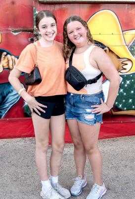 KAILYN LATHAM of Overland Park, and Tessa Look enjoyed each other’s company as they took in the Rooks County Free Fair.